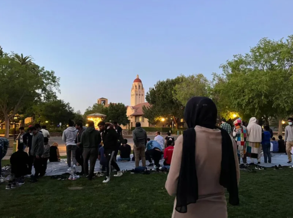 Students celebrate Iftar at Old Union, with Hoover Tower in the background